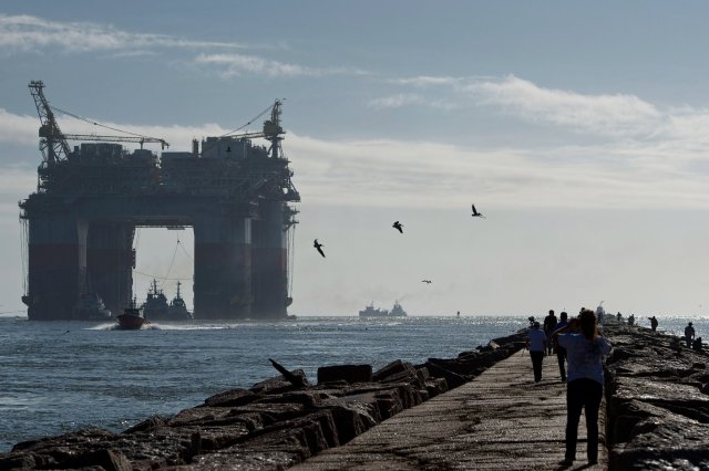Tugboats pulling offshore drilling platform Gulf of Mexico 2013